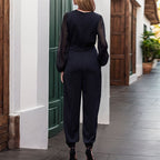 Elegant Jumpsuit with Sheer Sleeves and Deep V-Neck