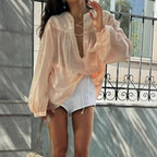 Airy Blouse with Ruffle Details and Decorative Lacing