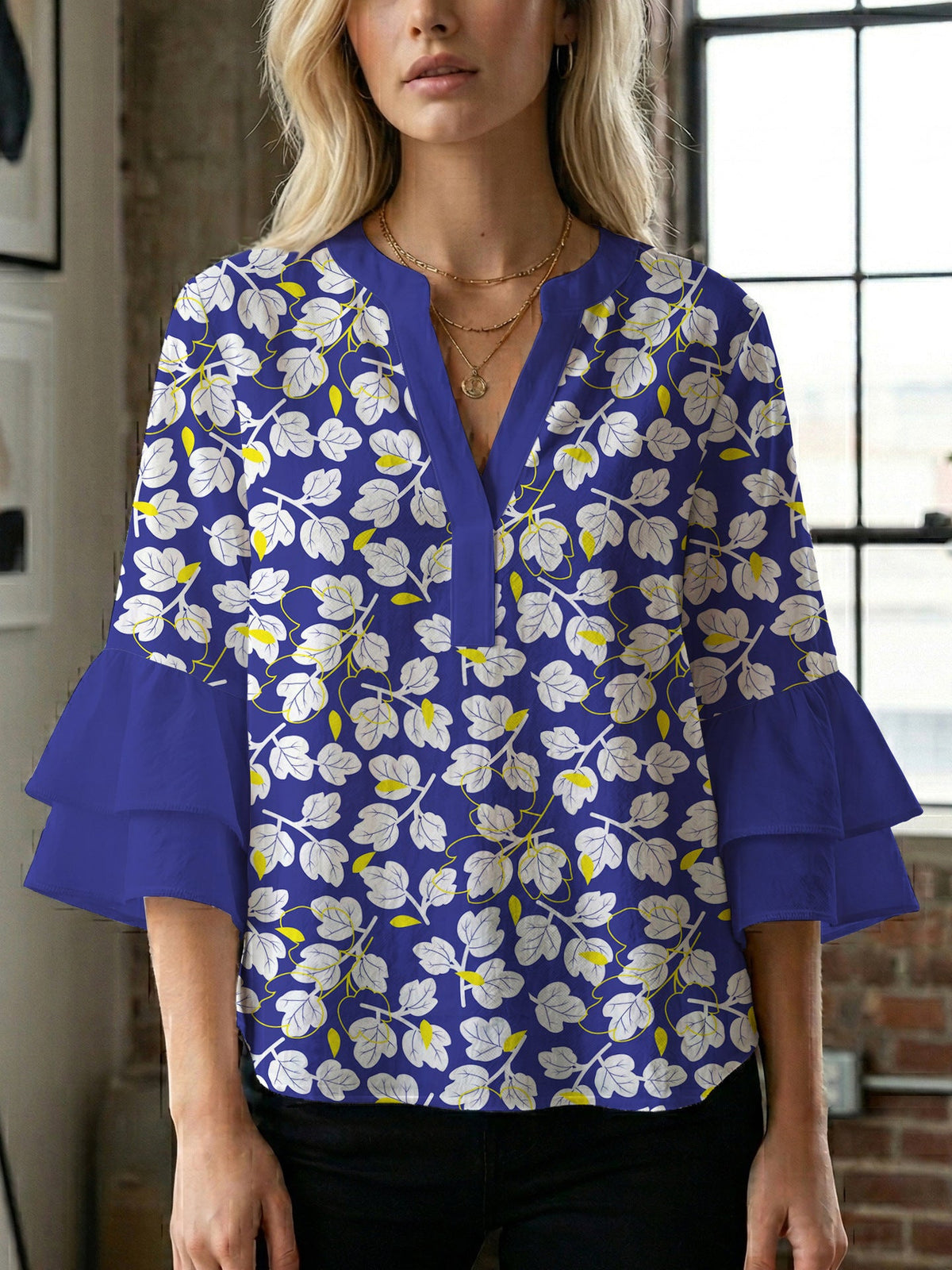 Women's Blouse with Voluminous Sleeves and Floral Design