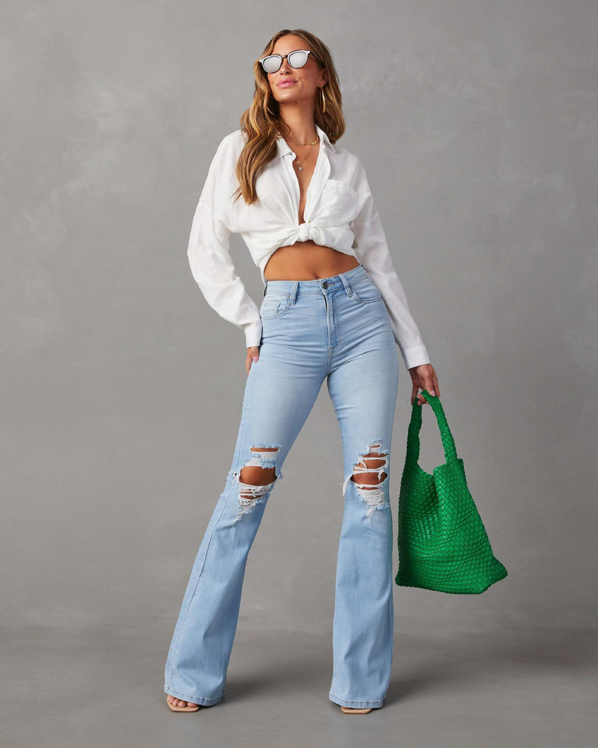 Women's Flared Jeans with Frayed Hem and Washed Effect
