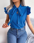 Women's Blouse with Ruffle Details and Chic Bow Element