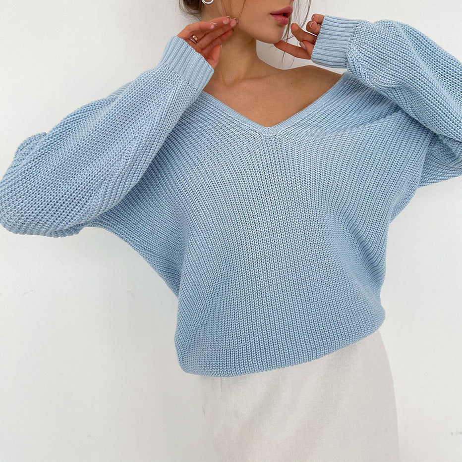 Elegant V-Neck Sweater with Fine Ribbed Texture and Drop Shoulders