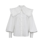 Elegant Blouse with Decorative Ruffle Collar and Puff Sleeves