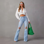 Women's Flared Jeans with Frayed Hem and Washed Effect