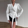 Elegant Blazer with Structured Details and Waist Belt