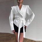Elegant Blazer with Structured Details and Waist Belt