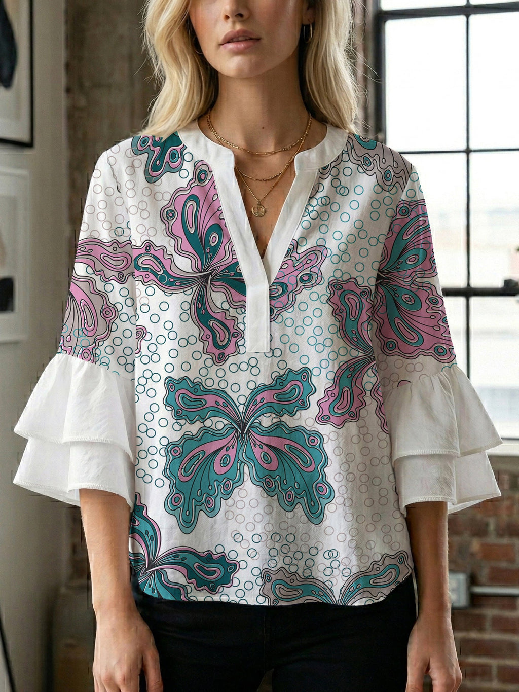 Women's Blouse with Voluminous Ruffle Sleeves and Floral Design