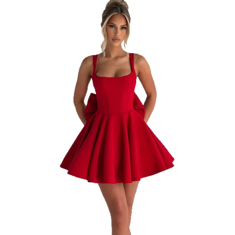 Women's Cocktail Dress with Oversized Bow Design and Flowing Skirt