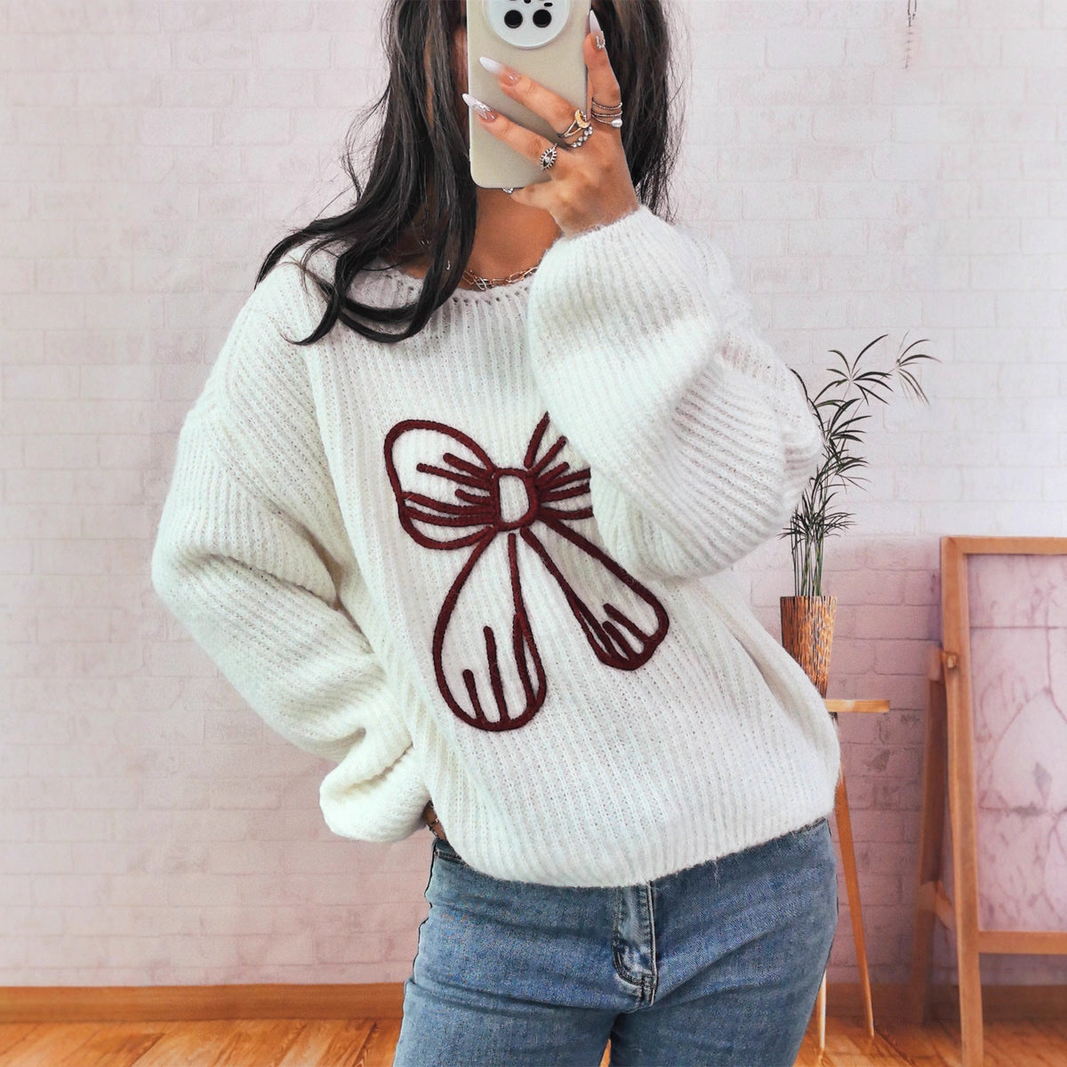 Women's Chunky Knit Sweater with Playful Bow Motif