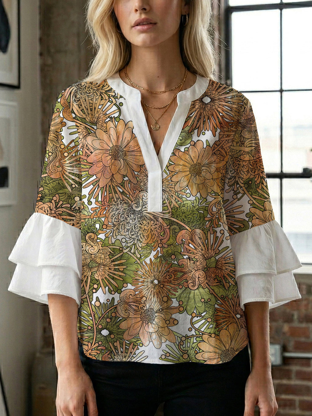 Women's Blouse with Voluminous Ruffle Sleeves and Floral Design