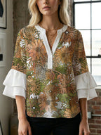 Women's Blouse with Voluminous Ruffle Sleeves and Floral Design