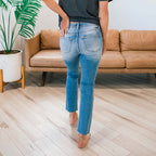 Women's High-Waist Jeans with Button Detail and Frayed Hem