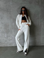 Women’s loungewear set with short zip jacket and high-waisted jogging pants with side split
