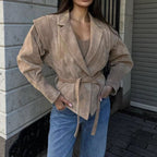 Elegant Blazer with Structured Details and Waist Belt