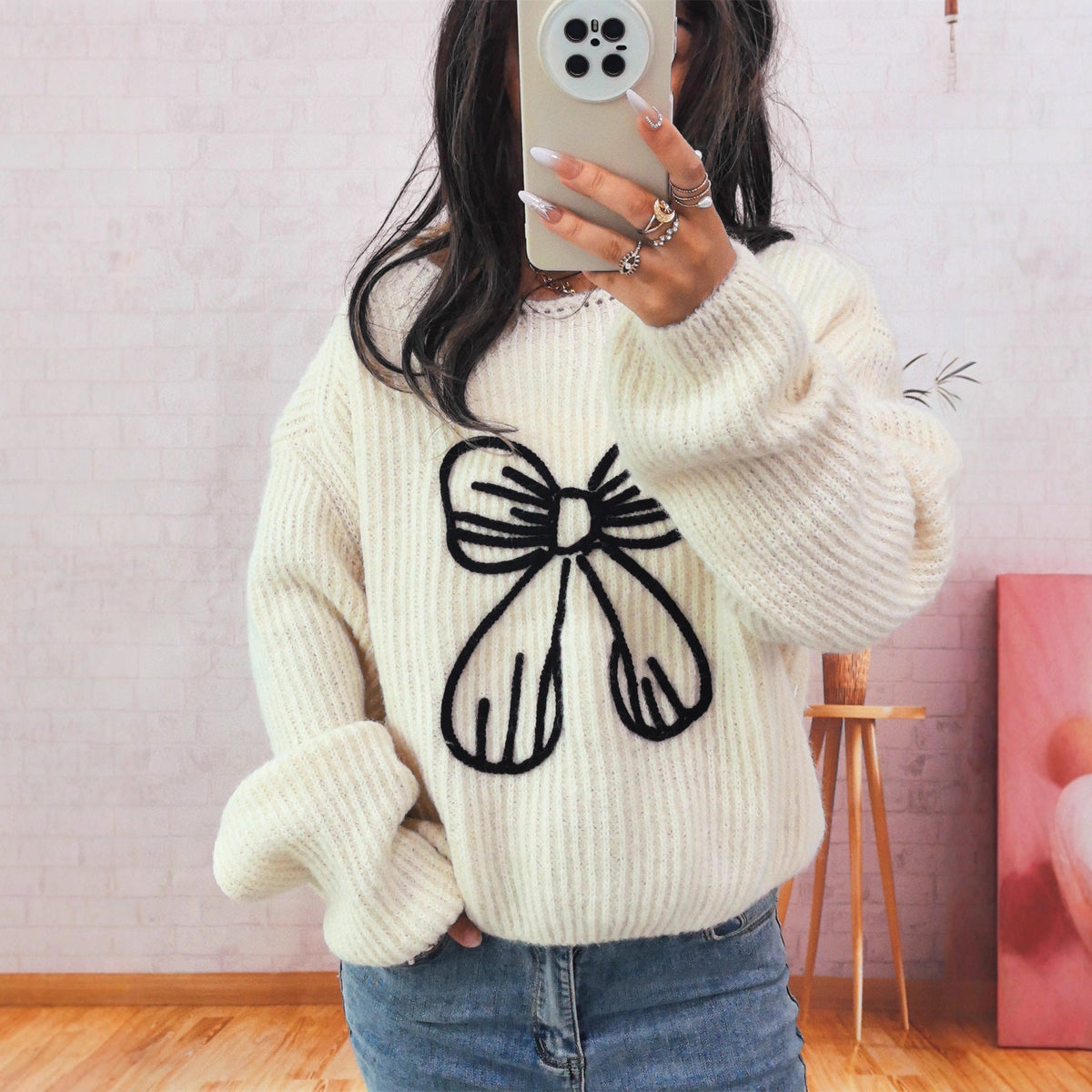 Women's Chunky Knit Sweater with Playful Bow Motif
