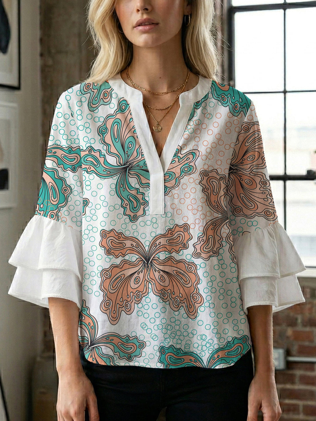 Women's Blouse with Voluminous Ruffle Sleeves and Floral Design