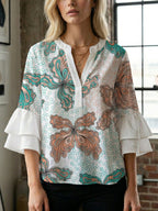 Women's Blouse with Voluminous Ruffle Sleeves and Floral Design