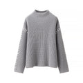 Women's Chunky Knit Sweater with High Collar and Decorative Details