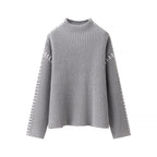 Women's Chunky Knit Sweater with High Collar and Decorative Details