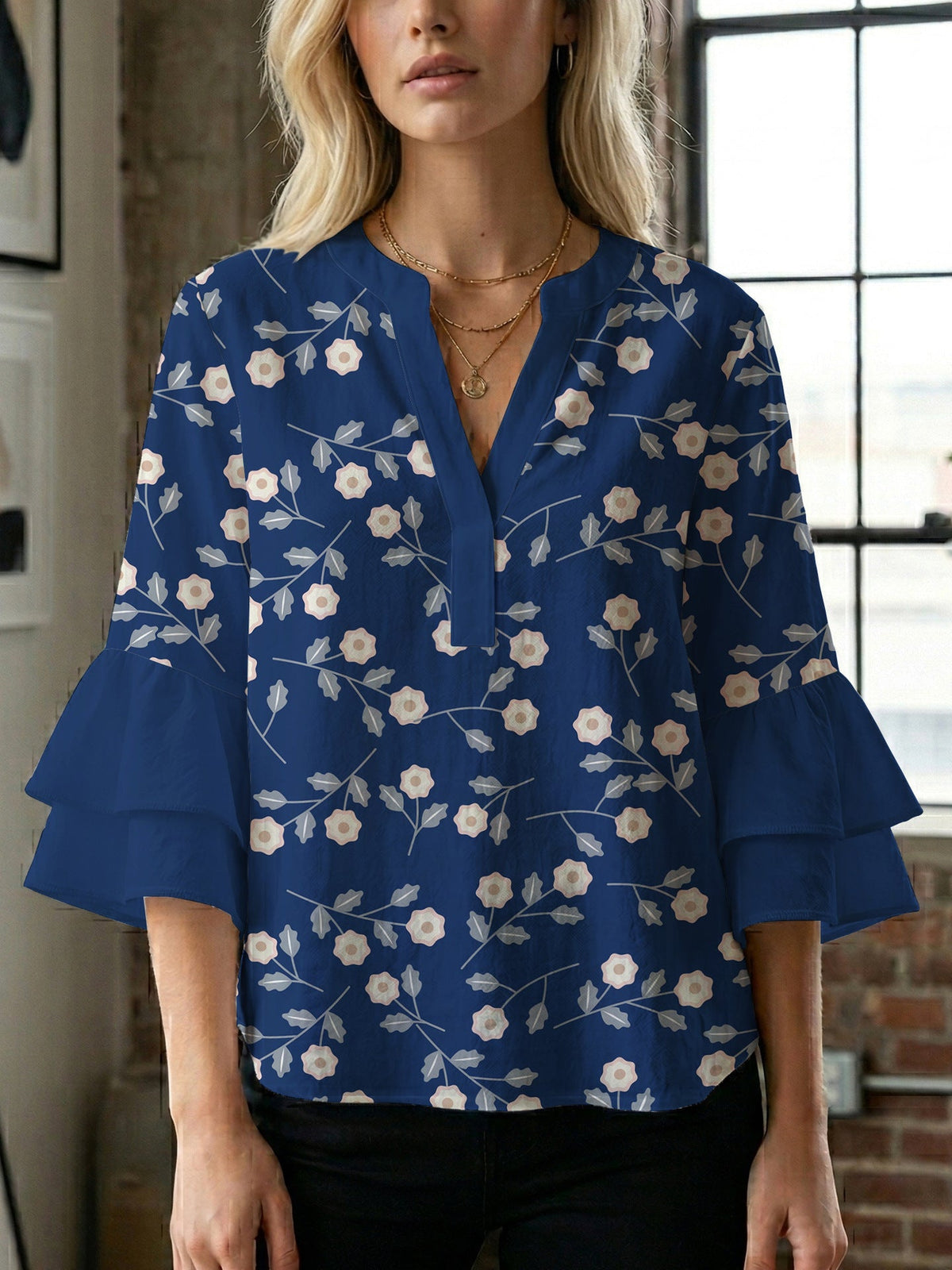Women's Blouse with Voluminous Sleeves and Floral Design