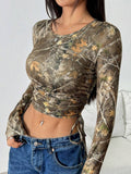 Women's Form-Fitting Long Sleeve Shirt with Ruching and Camouflage Design