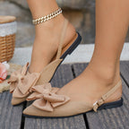 Ladies elegant lace ballerinas with large decorative bow and shimmering upper material