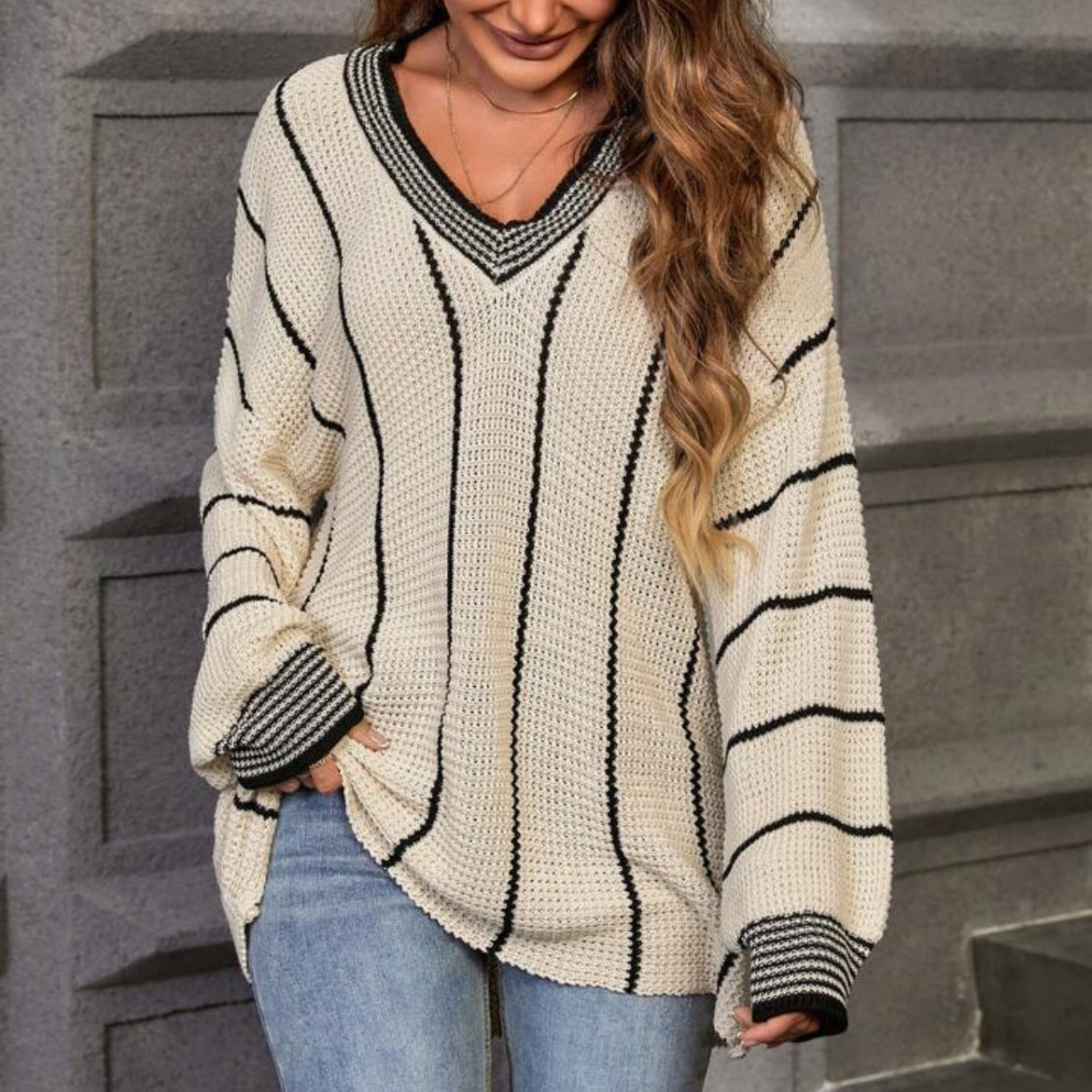 Women's Large Knit Sweater in Relaxed Oversized Style with V-Neck and Striped Pattern