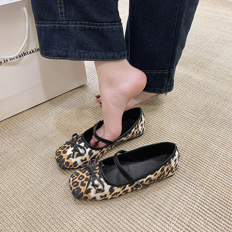 Women's ballet flats with decorative bow accent and comfortable adjustable strap