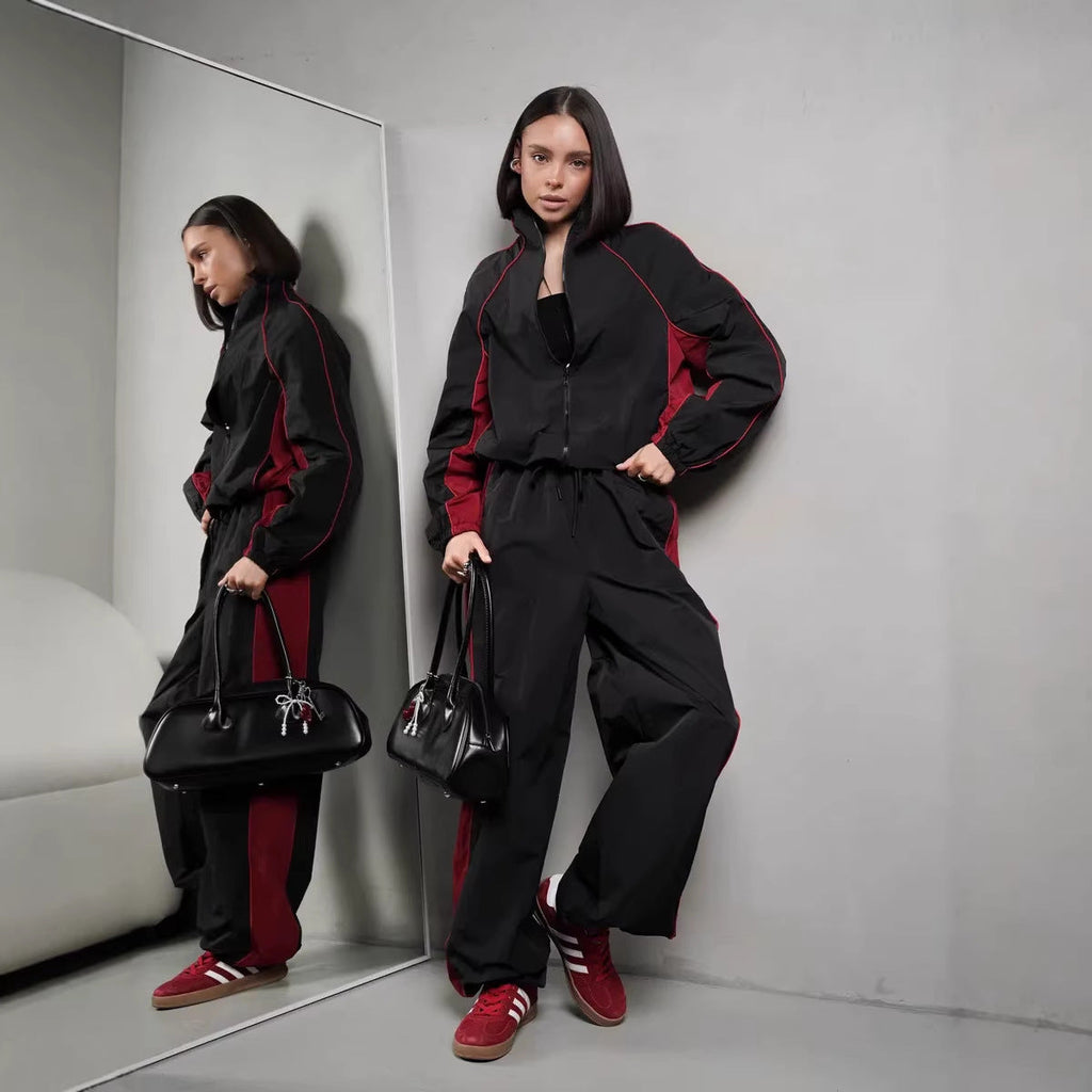 Women's sporty-elegant track set with stand-up collar, zip jacket, and wide side stripe trousers