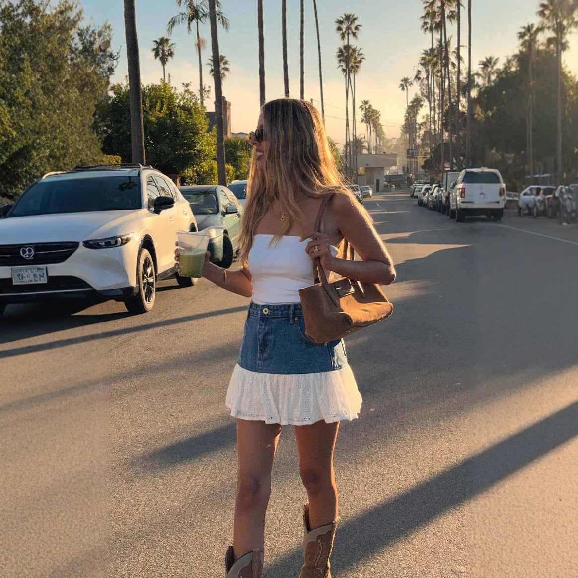 Women's Denim Skirt with Voluminous Ruffled Hem and Floral Detail