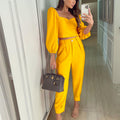 Elegant Women's Cropped Top and High-Waisted Trousers Set