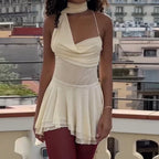 Elegant Asymmetrical Mini Dress with Decorative Shoulder Strap and Flowing Hem