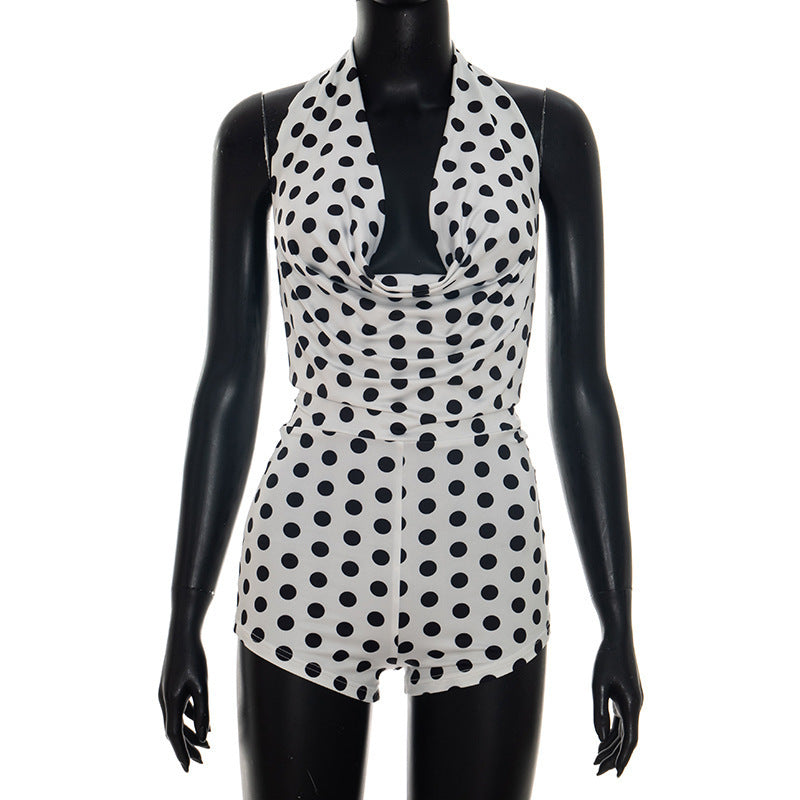 Elegant Playsuit with Deep V-Neck and Modern Polka Dot Pattern